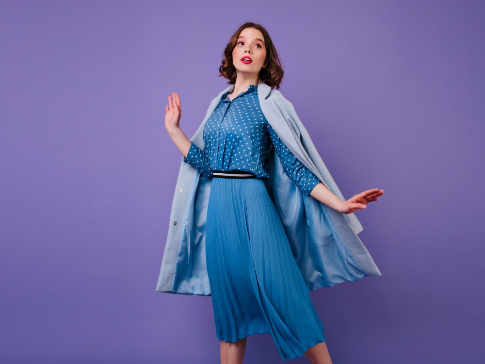 Emotional Brunette Woman Blue Coat Posing Purple Wall Indoor Photo Beautiful Short Haired Female Model Trendy Midi Dress