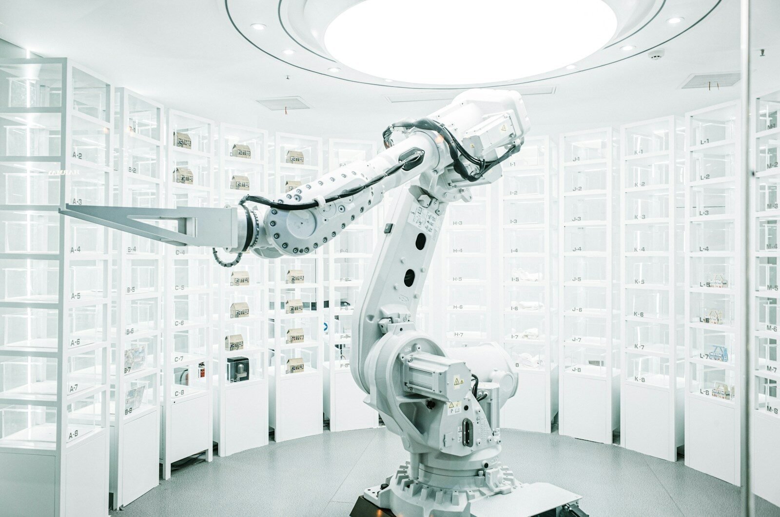 white robotic arm in display showroom